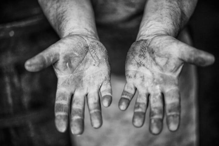 Black and white lifestyle photograph of Master Cooper Alastair Simms' hands, palms up by portrait photographer Andy Barnham