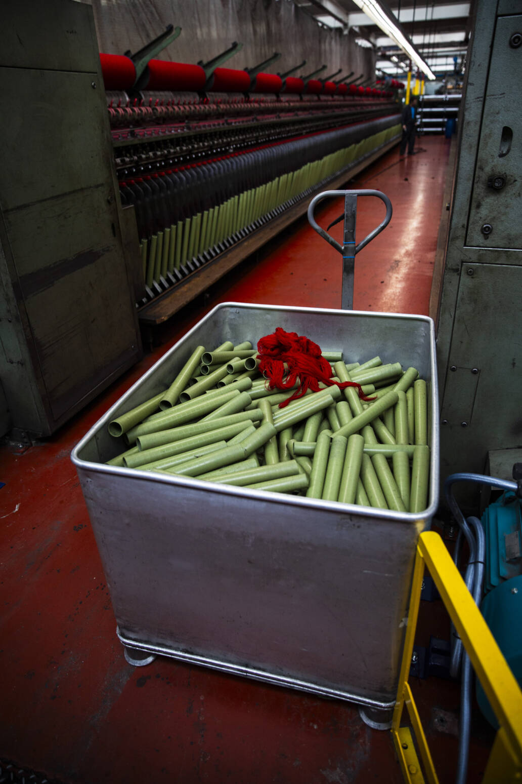 Empty thread rolls in a trolley in a cloth mill