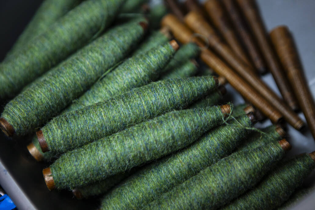 Yarns of green tweed thread