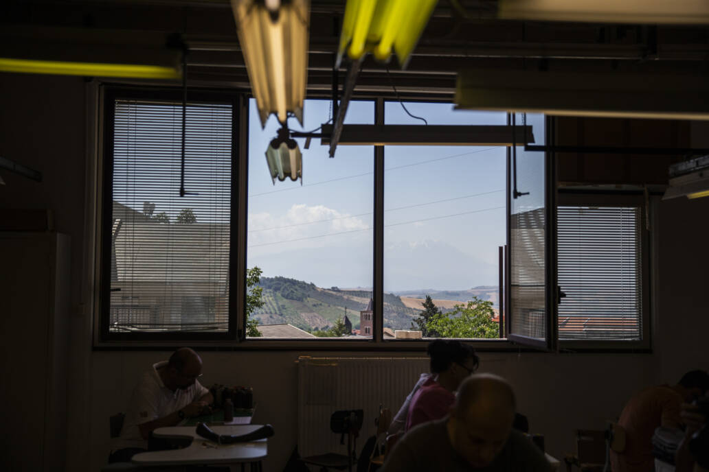 View of countryside and hills through a factory window