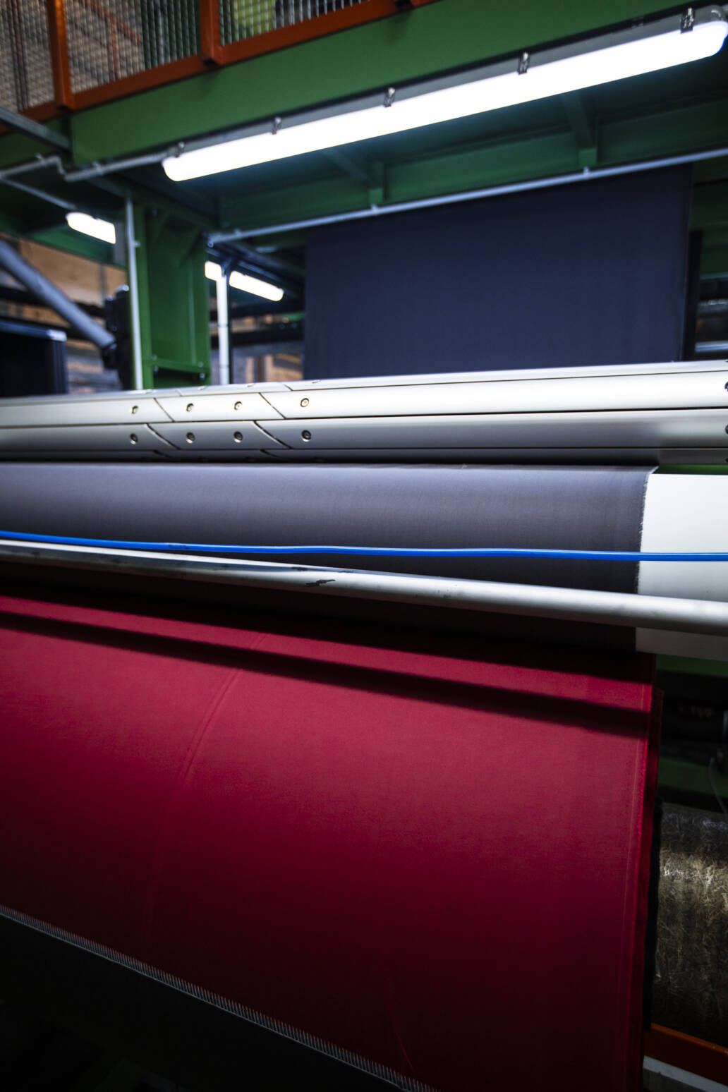 Multi coloured cloth on a loom