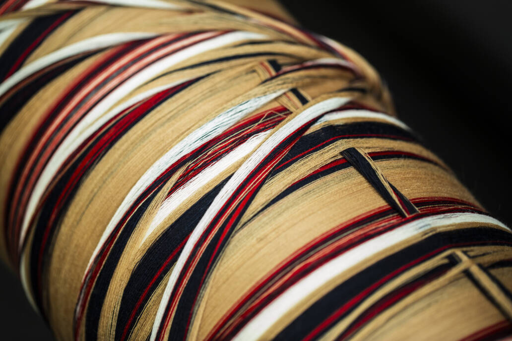 Large roll of threads in a cloth factory
