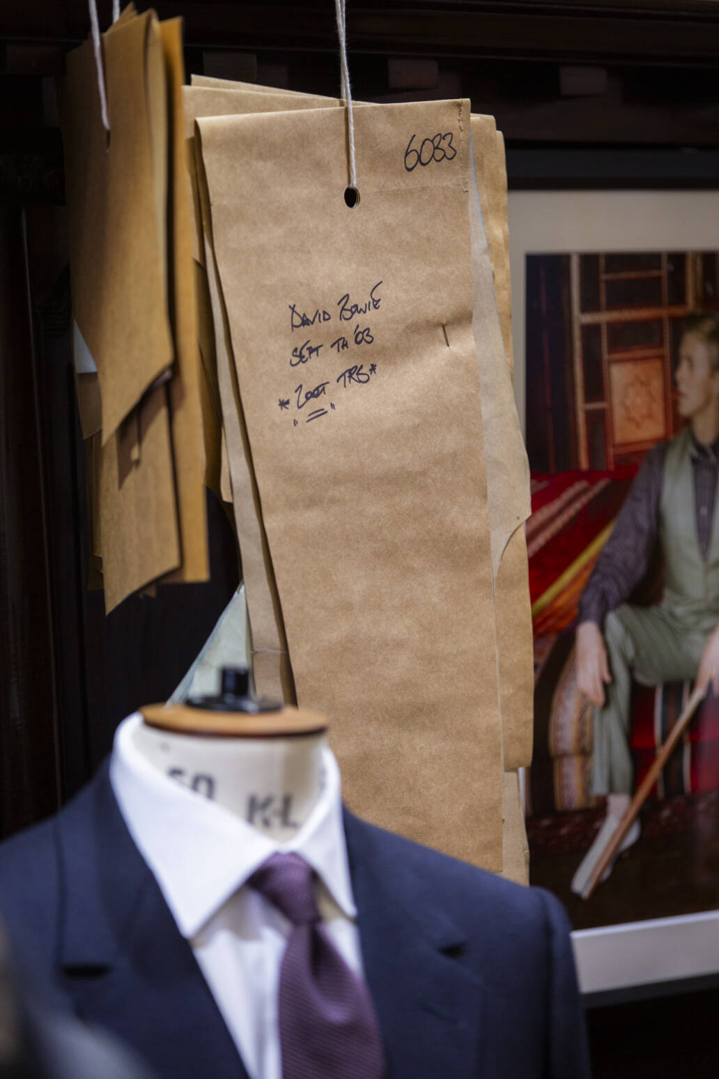 Suit pattern next to mannequin with bespoke suit
