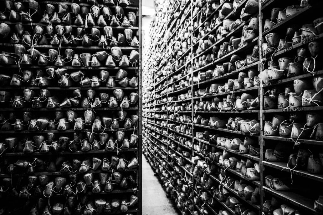 Room full of wooden shoe lasts stored on shelves